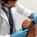 doctor checking balding hair